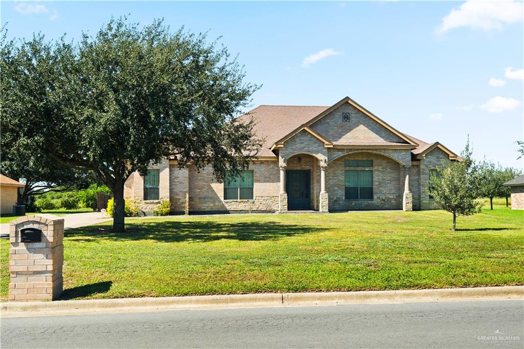 917 Beddoes Road La Feria, TX 78559 - Photo 2 of 20 a front view of a house with a yard