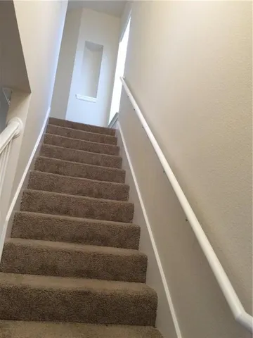 a view of an empty room with windows