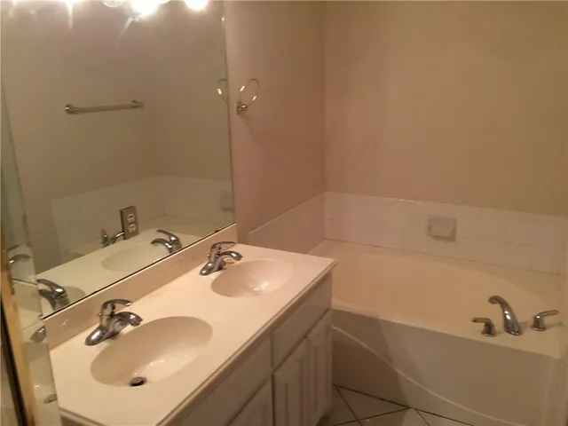 a bathroom with a sink toilet and vanity