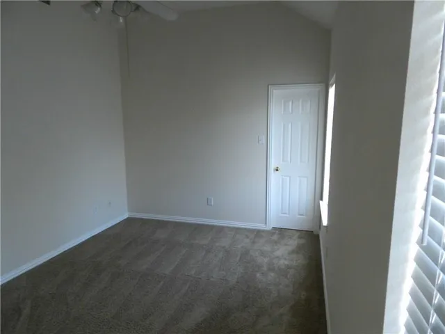 a view of a room that has a window in it