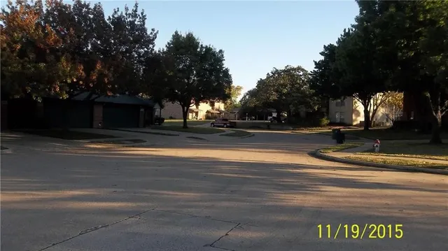 a view of a yard with trees