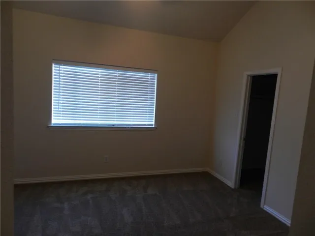 a view of a room that has a window in it