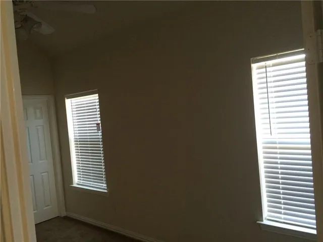 a front view of a house with parking