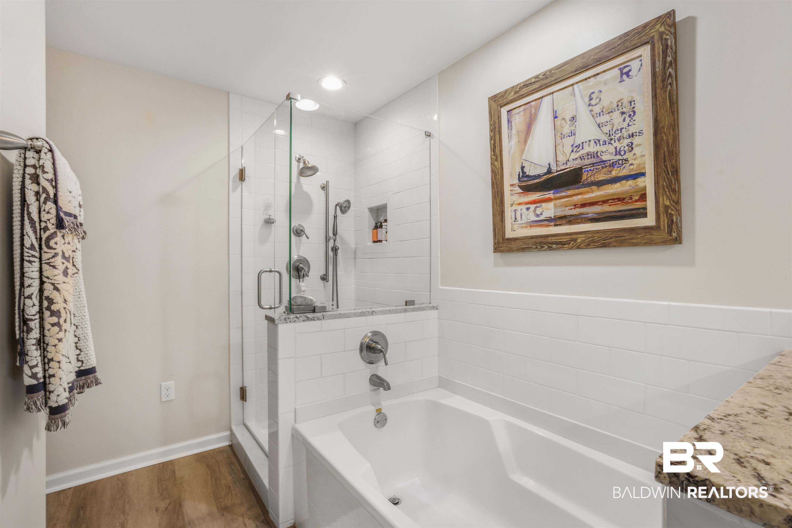 27282 Canal Road, Unit 511 Orange Beach, AL 36561 - Photo 12 of 29 Bathroom featuring a bath, a shower stall, wood finished floors, vanity, and recessed lighting