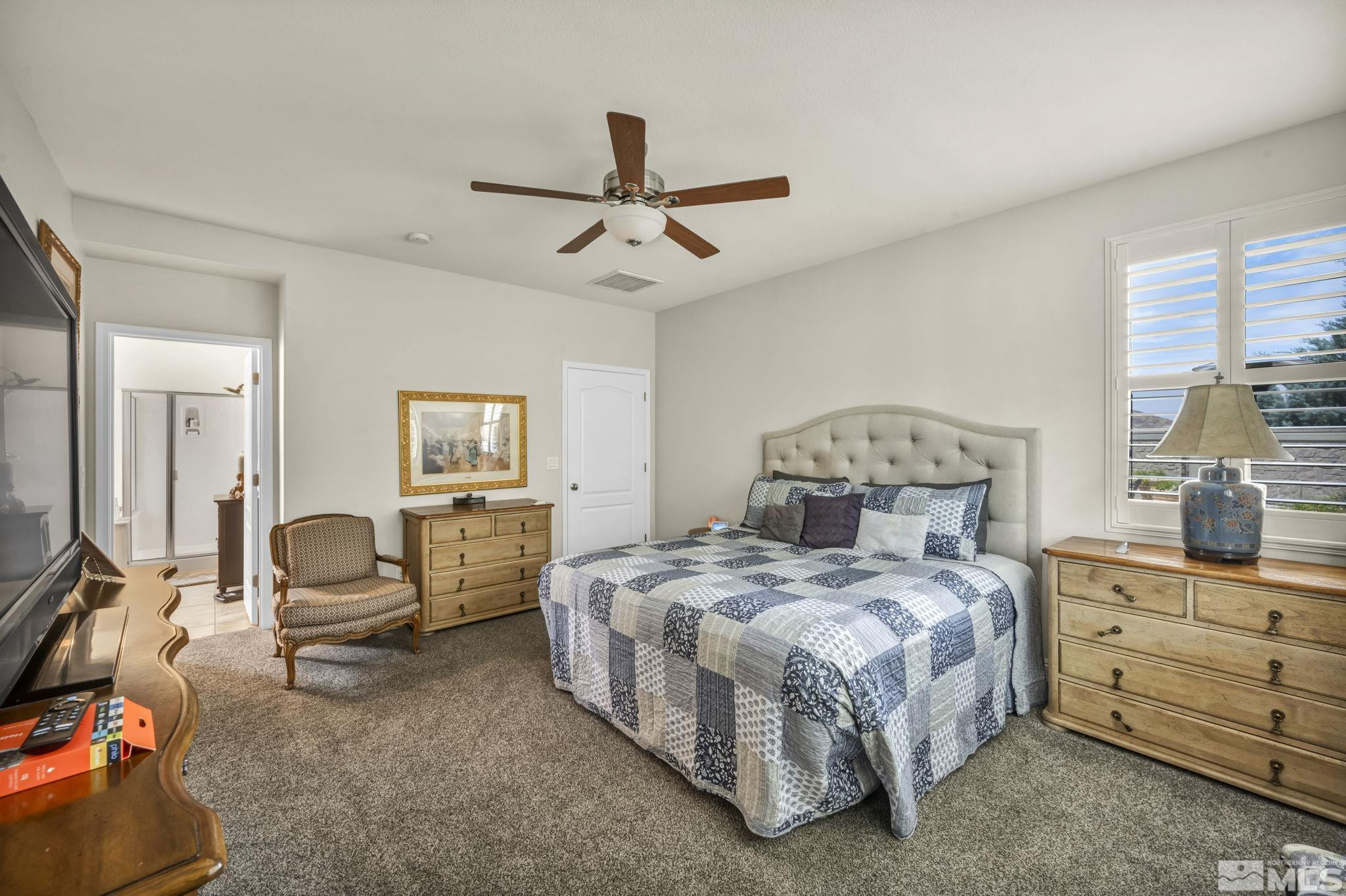 2199 Angel Ridge Drive Reno, NV 89521 - Photo 16 of 36 a bedroom with a bed and furniture