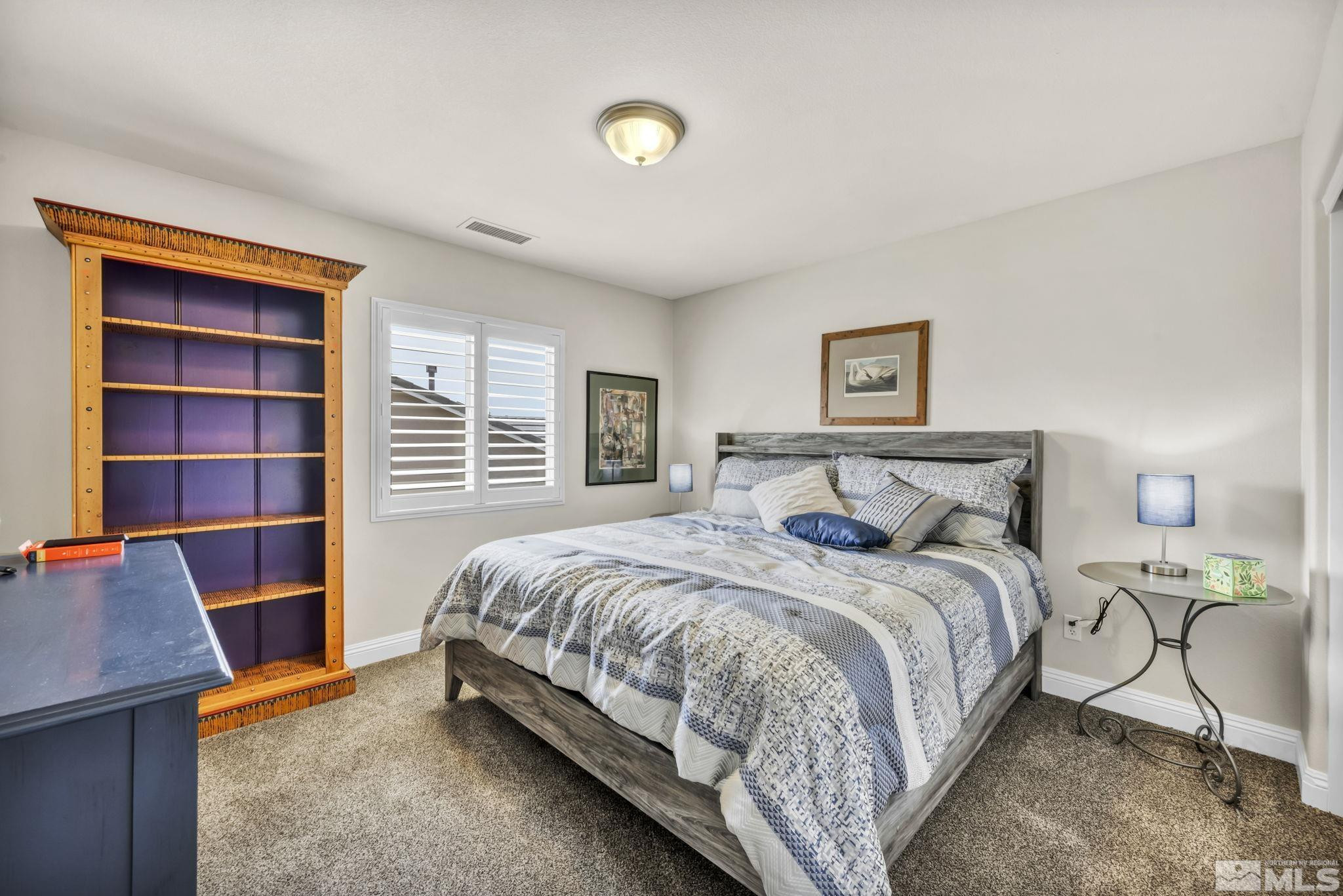 2199 Angel Ridge Drive Reno, NV 89521 - Photo 24 of 36 a bedroom with a bed and a cabinets