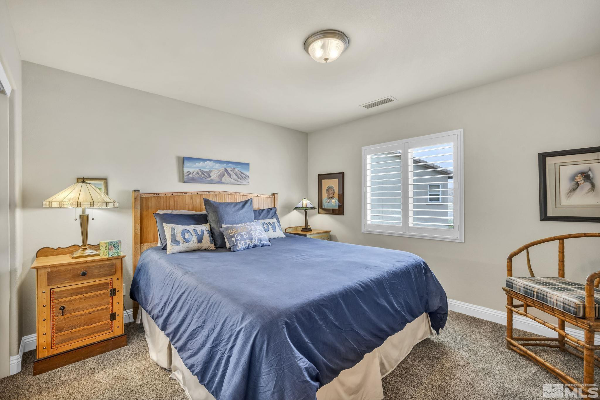 2199 Angel Ridge Drive Reno, NV 89521 - Photo 26 of 36 a bedroom with a bed and a dresser with a bookshelf