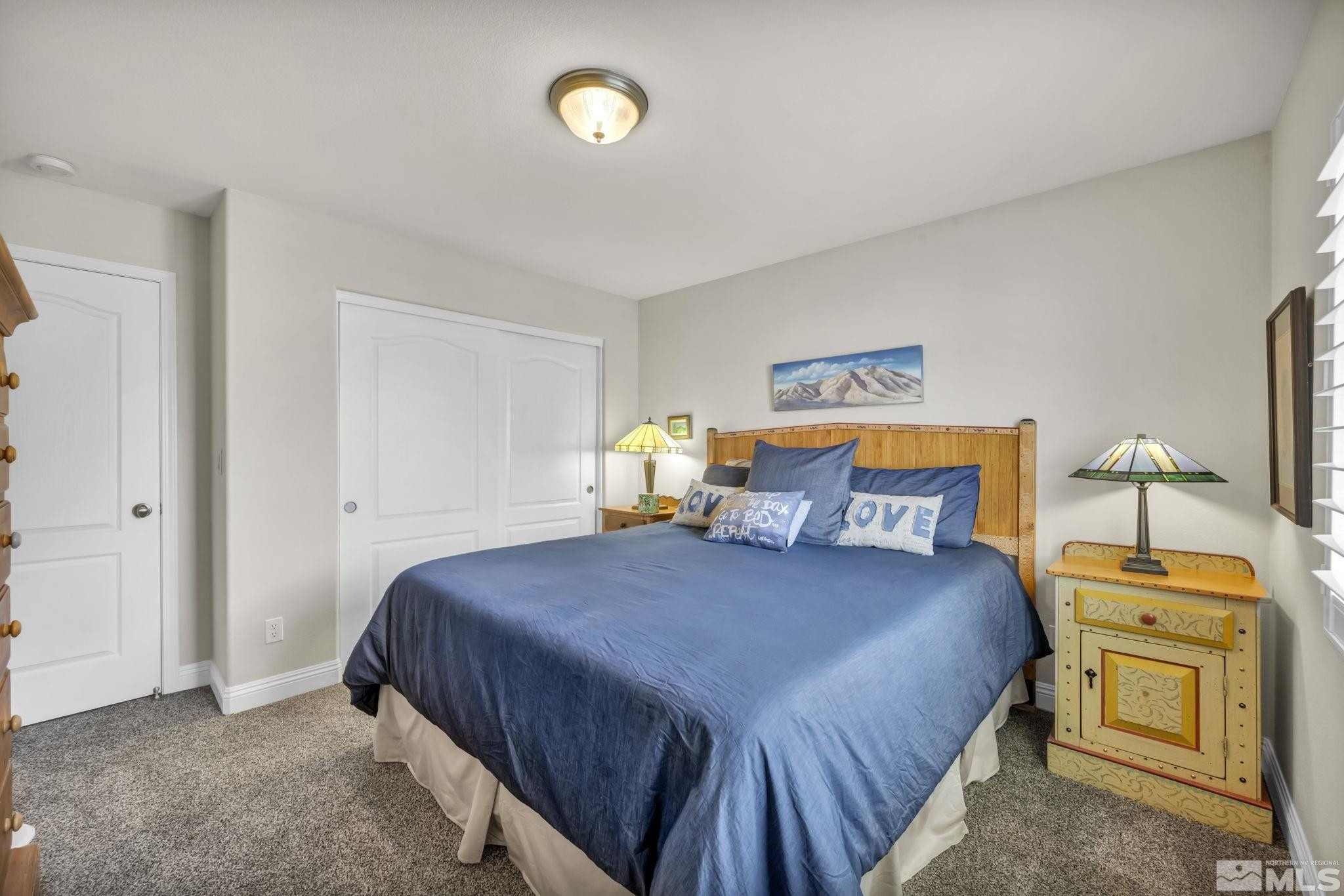 2199 Angel Ridge Drive Reno, NV 89521 - Photo 27 of 36 a bedroom with a bed and dresser