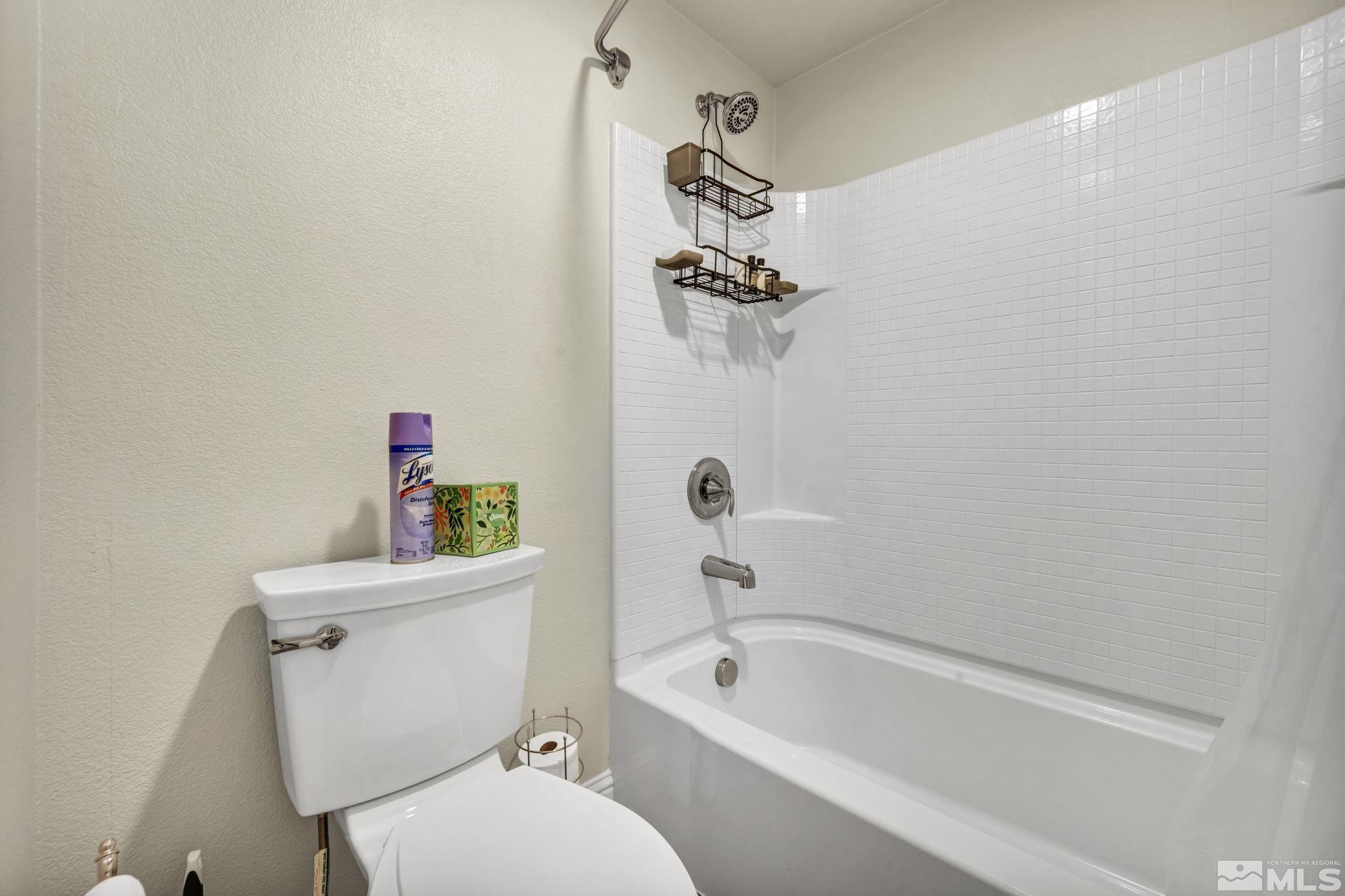 2199 Angel Ridge Drive Reno, NV 89521 - Photo 30 of 36 a white toilet sitting next to a bath tub and a shower