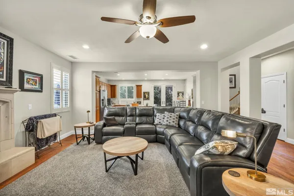 a living room with furniture and a chair