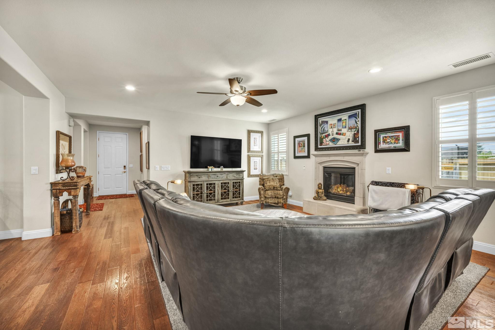 2199 Angel Ridge Drive Reno, NV 89521 - Photo 10 of 36 a living room with furniture and a flat screen tv