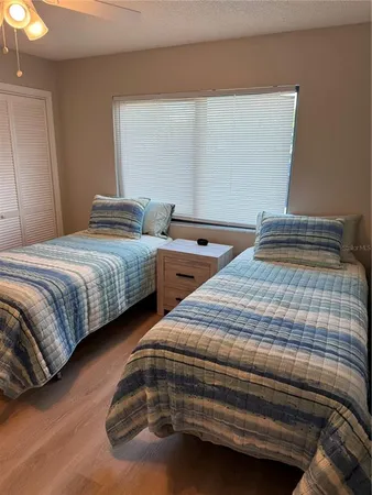 a bedroom with two beds and painted walls