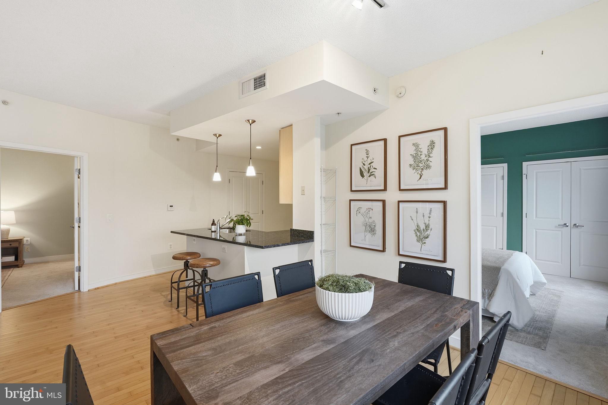 820 North Pollard Street, Unit 504 Arlington, VA 22203 - Photo 11 of 27 a living room with furniture and wooden floor