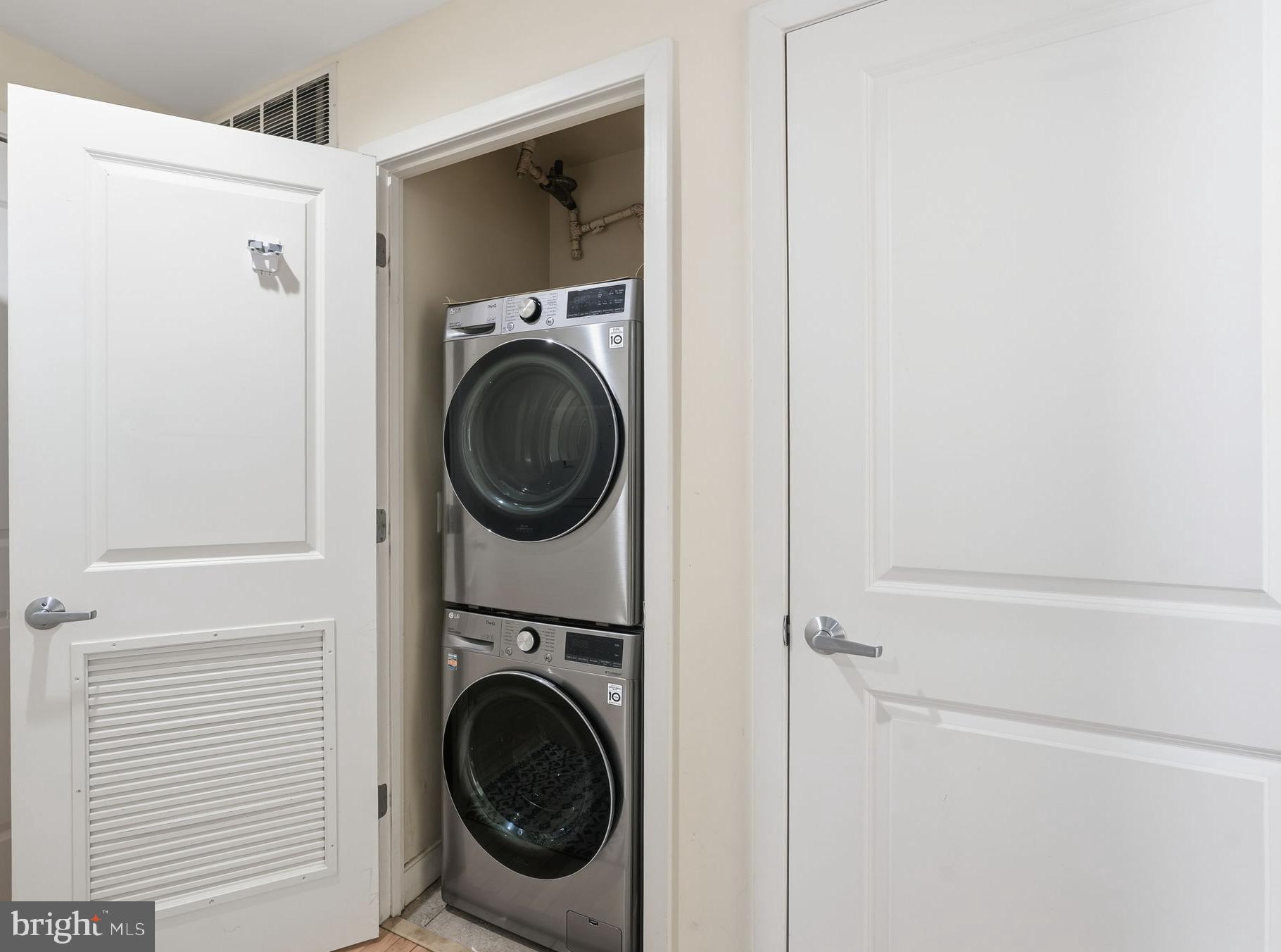 820 North Pollard Street, Unit 504 Arlington, VA 22203 - Photo 21 of 27 a utility room with dryer and washer