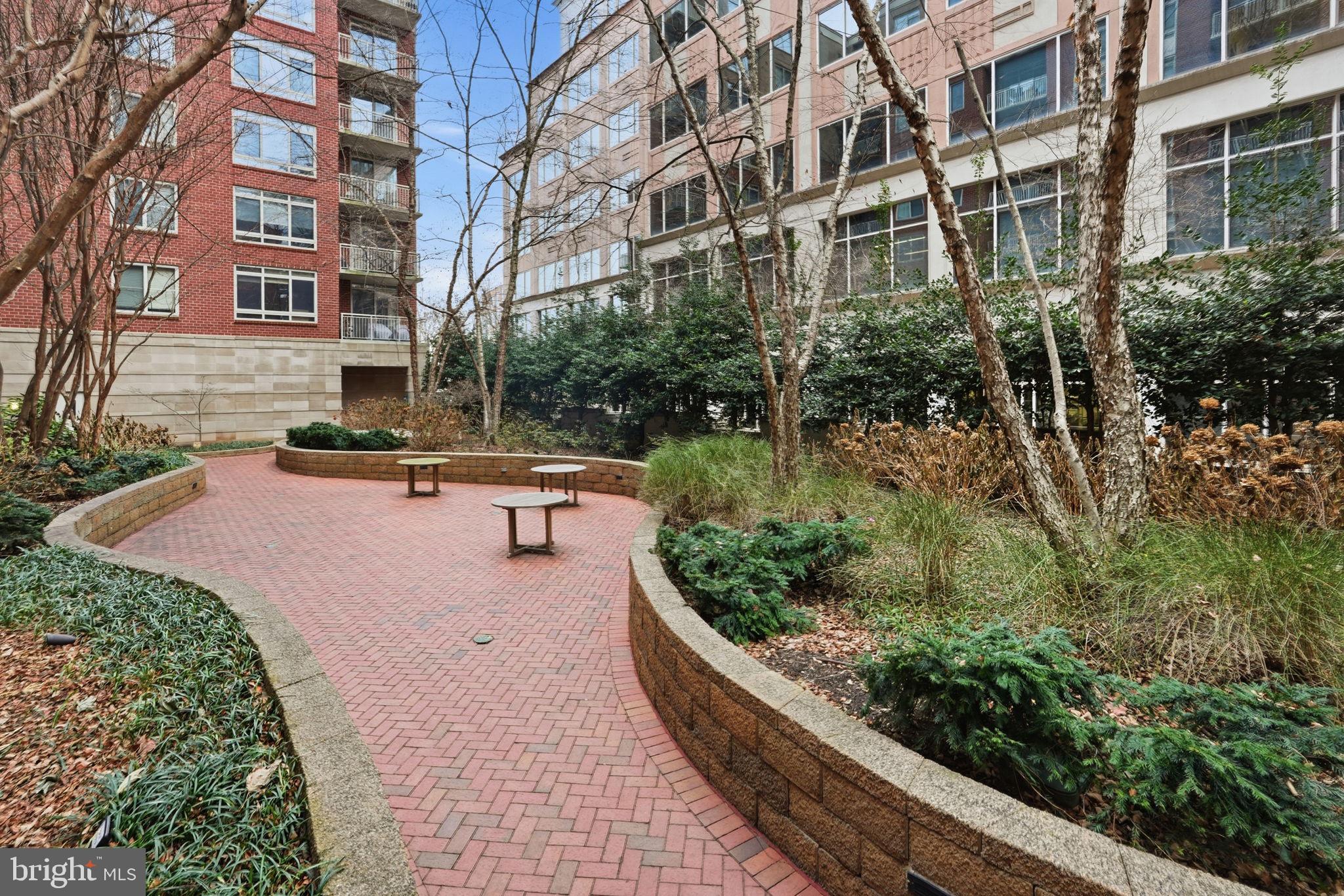 820 North Pollard Street, Unit 504 Arlington, VA 22203 - Photo 23 of 27 a view of a building with garden and sitting area