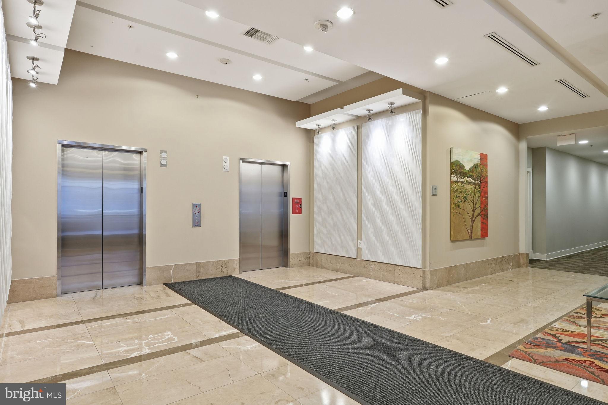 820 North Pollard Street, Unit 504 Arlington, VA 22203 - Photo 25 of 27 a view of a hallway with wooden floor