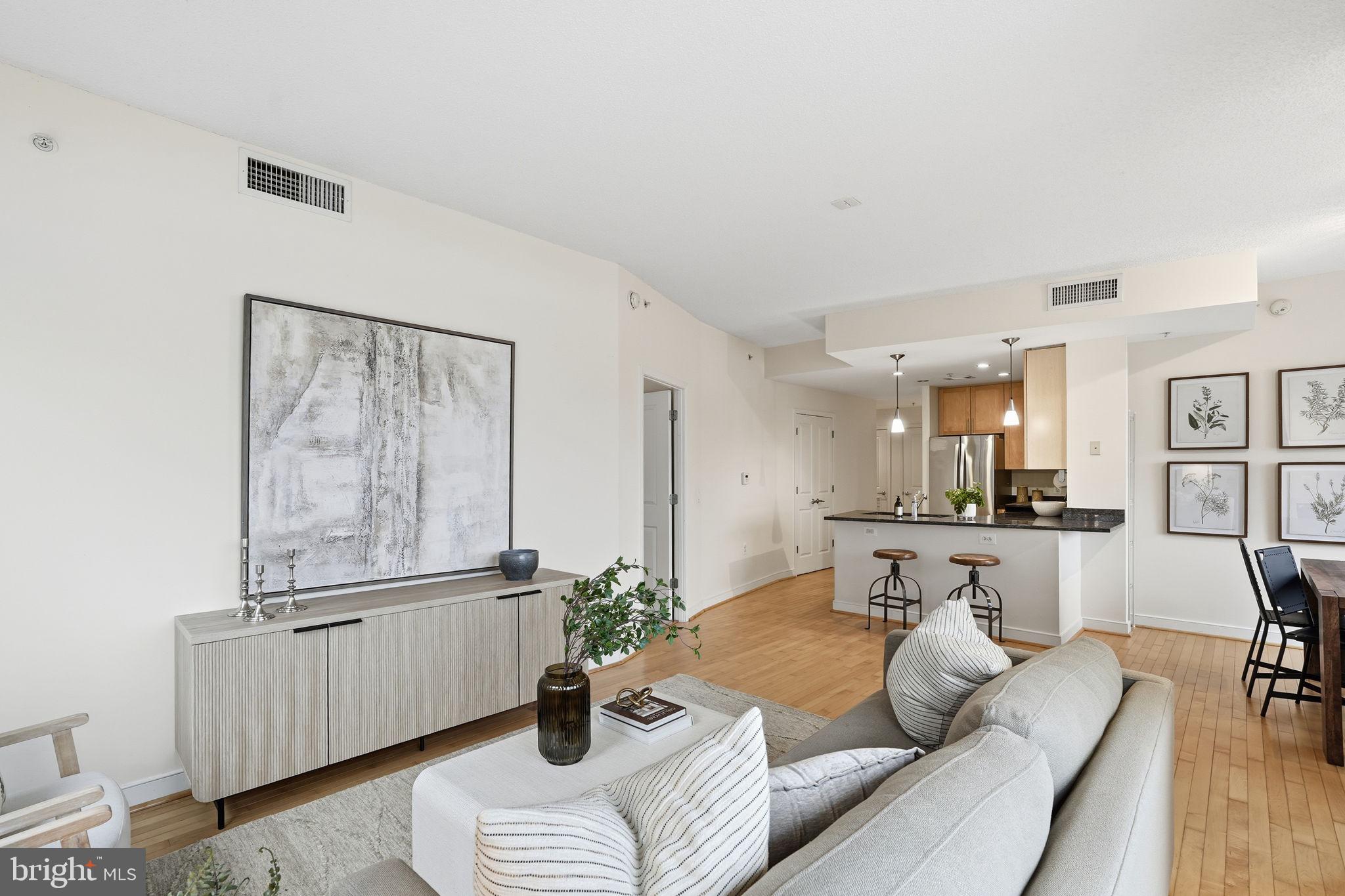 820 North Pollard Street, Unit 504 Arlington, VA 22203 - Photo 6 of 27 a living room with furniture and wooden floor