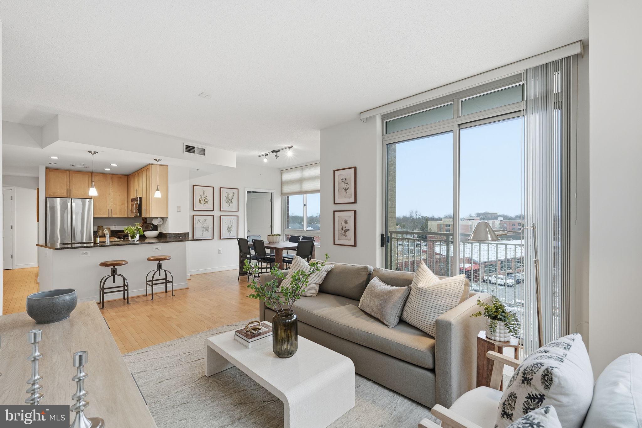 820 North Pollard Street, Unit 504 Arlington, VA 22203 - Photo 7 of 27 a living room with furniture and a large window