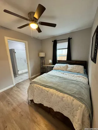 a bedroom with a bed and a mirror