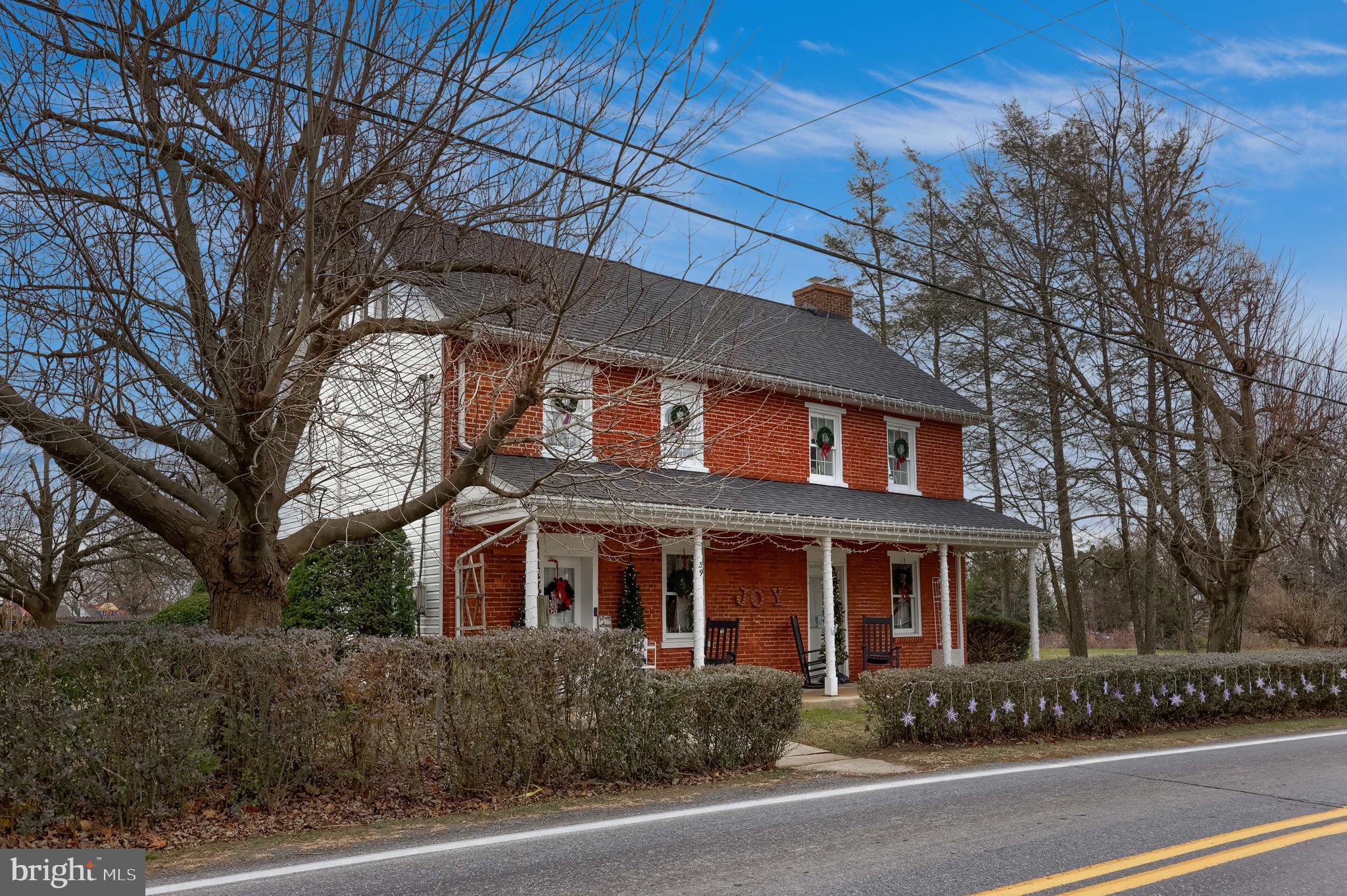 39 North Maple Avenue Leola, PA 17540 - Photo 2 of 44 a front view of a house with a yard