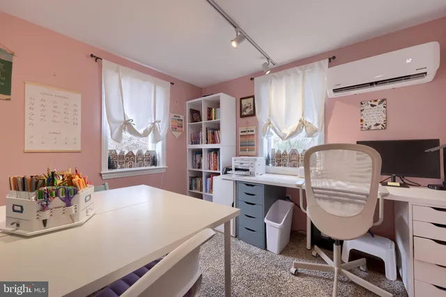 a view of a dining room with furniture and window