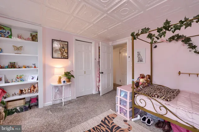 a bedroom with a bed and furniture