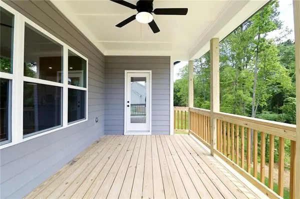 a view of a balcony with wooden floor