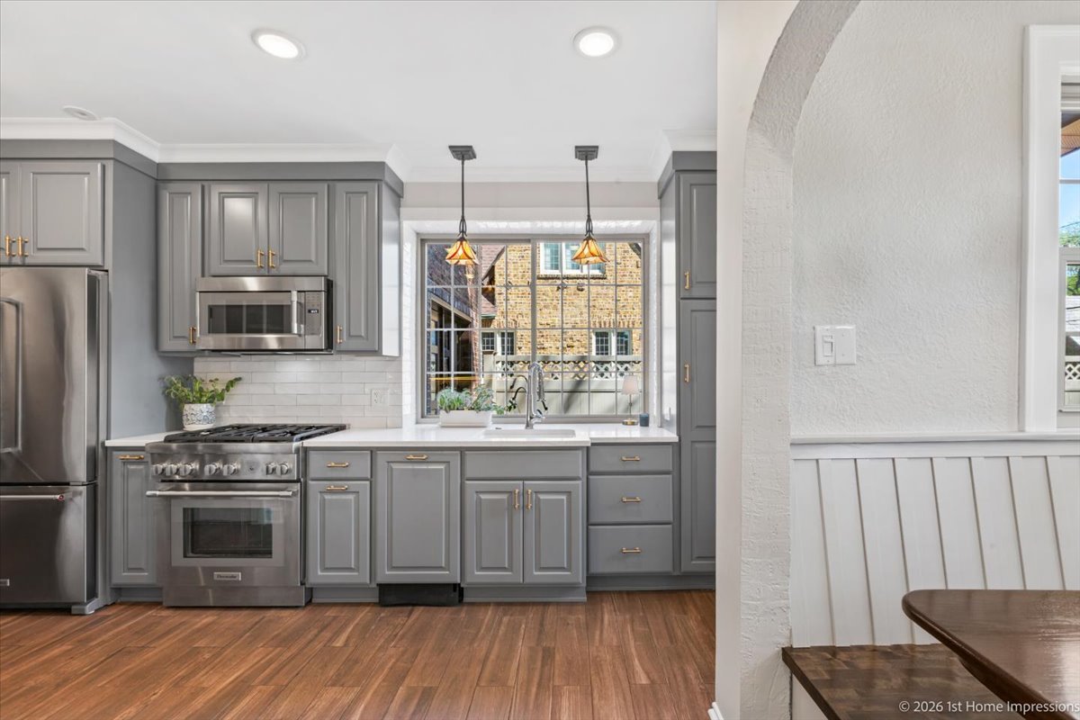 9955 South Hamilton Avenue Chicago, IL 60643 - Photo 12 of 31 a kitchen with stainless steel appliances a stove a sink and a refrigerator