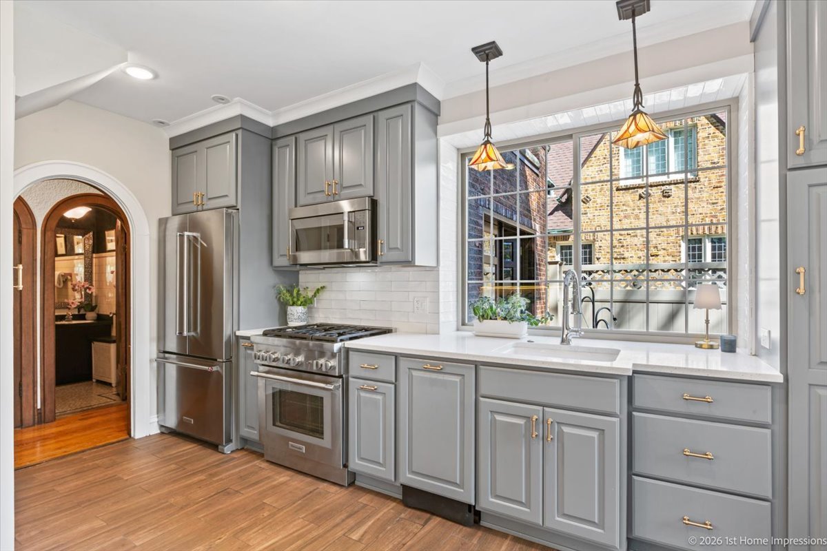 9955 South Hamilton Avenue Chicago, IL 60643 - Photo 13 of 31 a kitchen with stainless steel appliances granite countertop a refrigerator a stove a sink and white cabinets with wooden floor