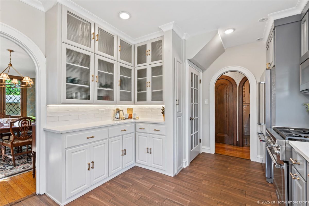 9955 South Hamilton Avenue Chicago, IL 60643 - Photo 14 of 31 a view of cabinets with wooden floor and windows