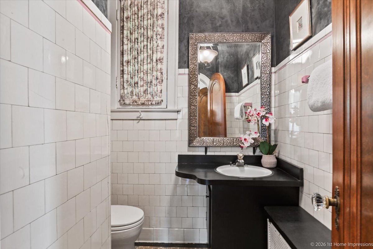 9955 South Hamilton Avenue Chicago, IL 60643 - Photo 15 of 31 a bathroom with a sink and a mirror