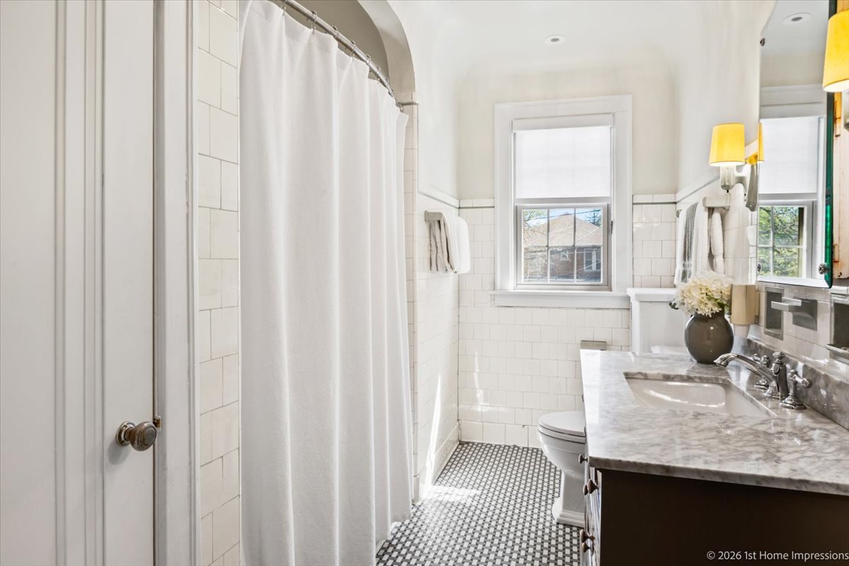 9955 South Hamilton Avenue Chicago, IL 60643 - Photo 22 of 31 a bathroom with a granite countertop sink and a mirror