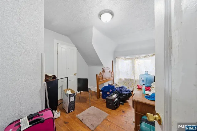 a living room with furniture chess board and a window