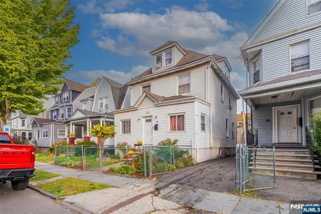 an aerial view of residential building and parking space