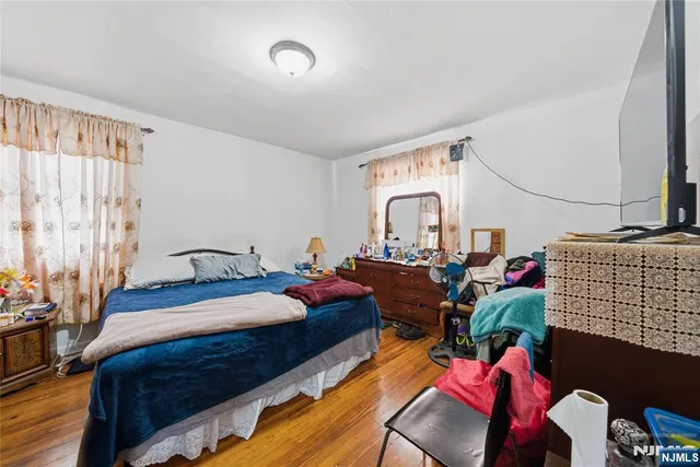 a bedroom with bed and a window