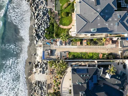 an aerial view of a house with sitting area