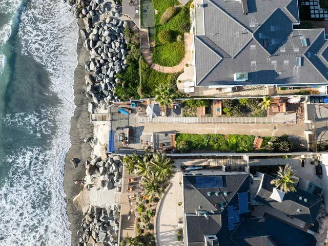 an aerial view of a house with sitting area