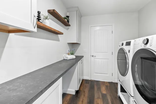 a hallway with washer and dryer