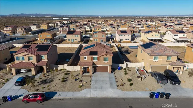 an aerial view of a building with outdoor seating