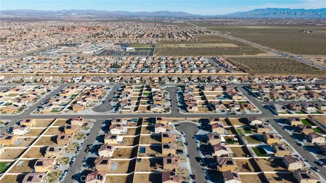 an aerial view of a city with ocean view