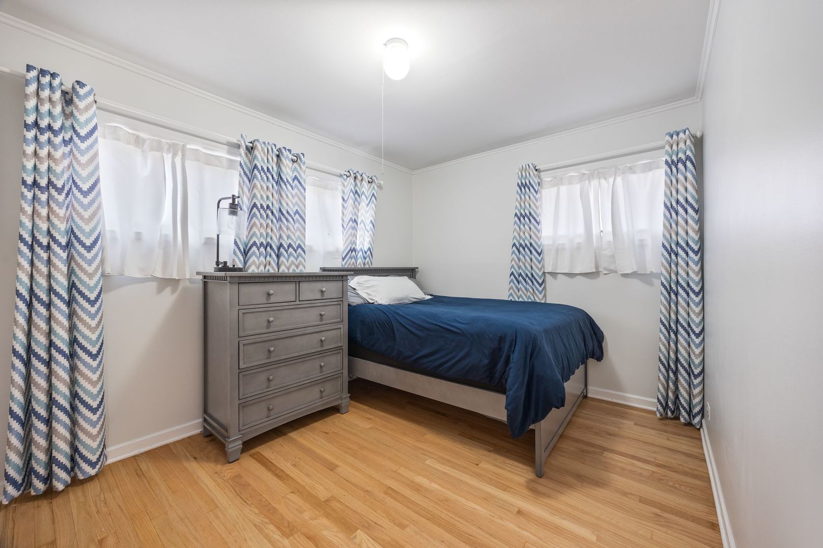 1145 Dell Road Northbrook, IL 60062 - Photo 14 of 22 a spacious bedroom with a bed and a window