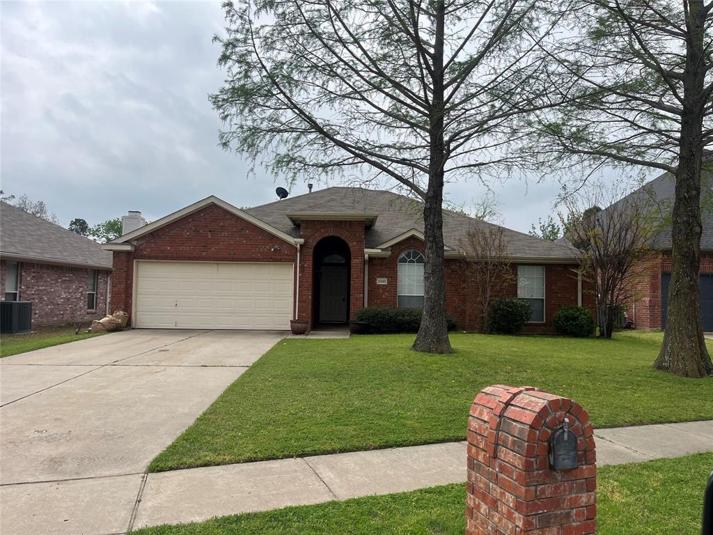 3320 Peakview Drive Corinth, TX 76210 - Photo 1 of 1 a front view of a house with a yard and garage