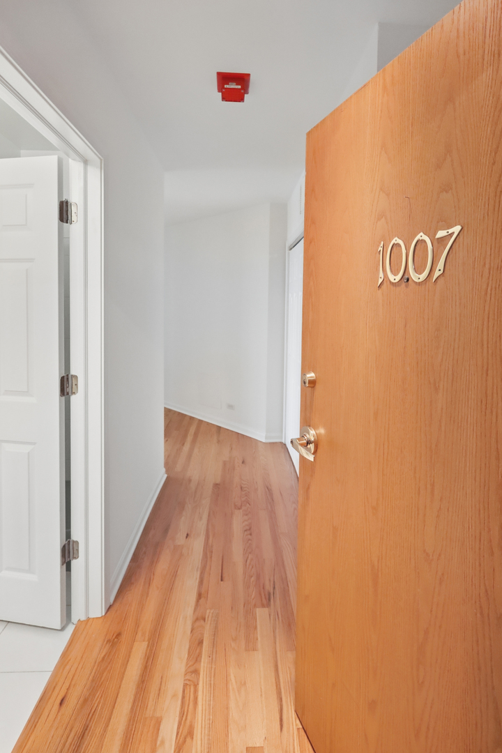 161 West Harrison Street, Unit 1007 Chicago, IL 60605 - Photo 3 of 35 a view of a room with wooden floor
