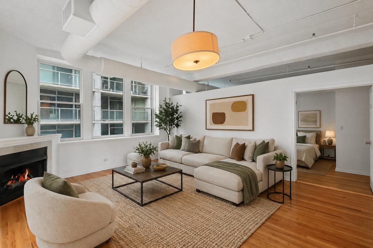 161 West Harrison Street, Unit 1007 Chicago, IL 60605 - Photo 6 of 35 a living room with furniture and a large window