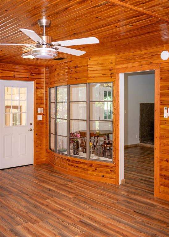 523 Big Lake Road Karnack, TX 75661 - Photo 14 of 27 a view of a room with wooden floor and windows