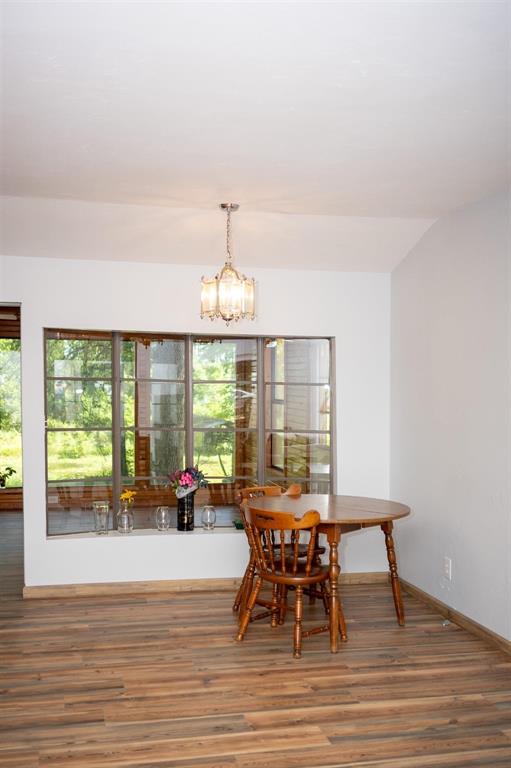 523 Big Lake Road Karnack, TX 75661 - Photo 15 of 27 a view of a dining room with furniture window and outside view