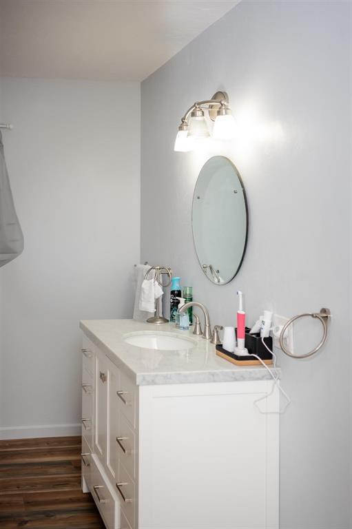 523 Big Lake Road Karnack, TX 75661 - Photo 20 of 27 a bathroom with a sink and a mirror