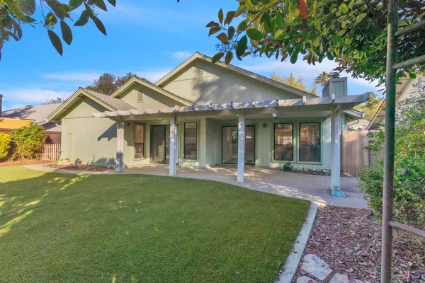 a front view of a house with a garden and porch