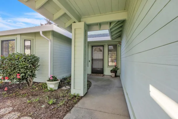 a view of a brick house with a potted plants