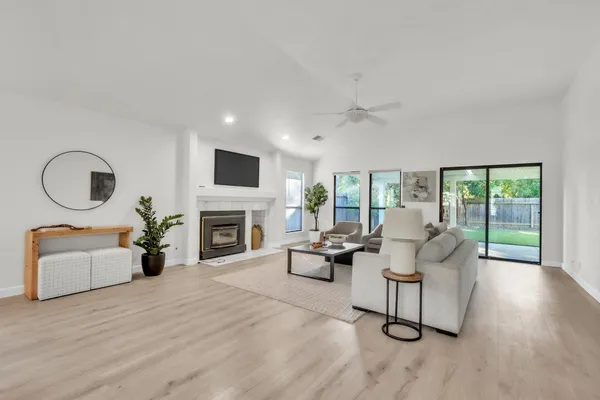 a living room with furniture and a fireplace